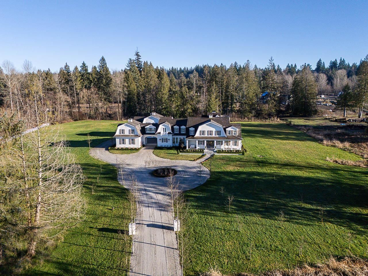 Grace Acres Estate aerial view showing circular motor court and 12.5 gated acres, Langley BC