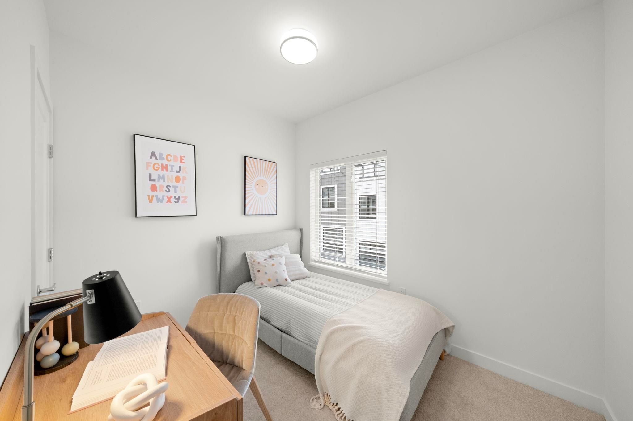 Second secondary bedroom at 6-728 Lea Avenue with desk setup and window