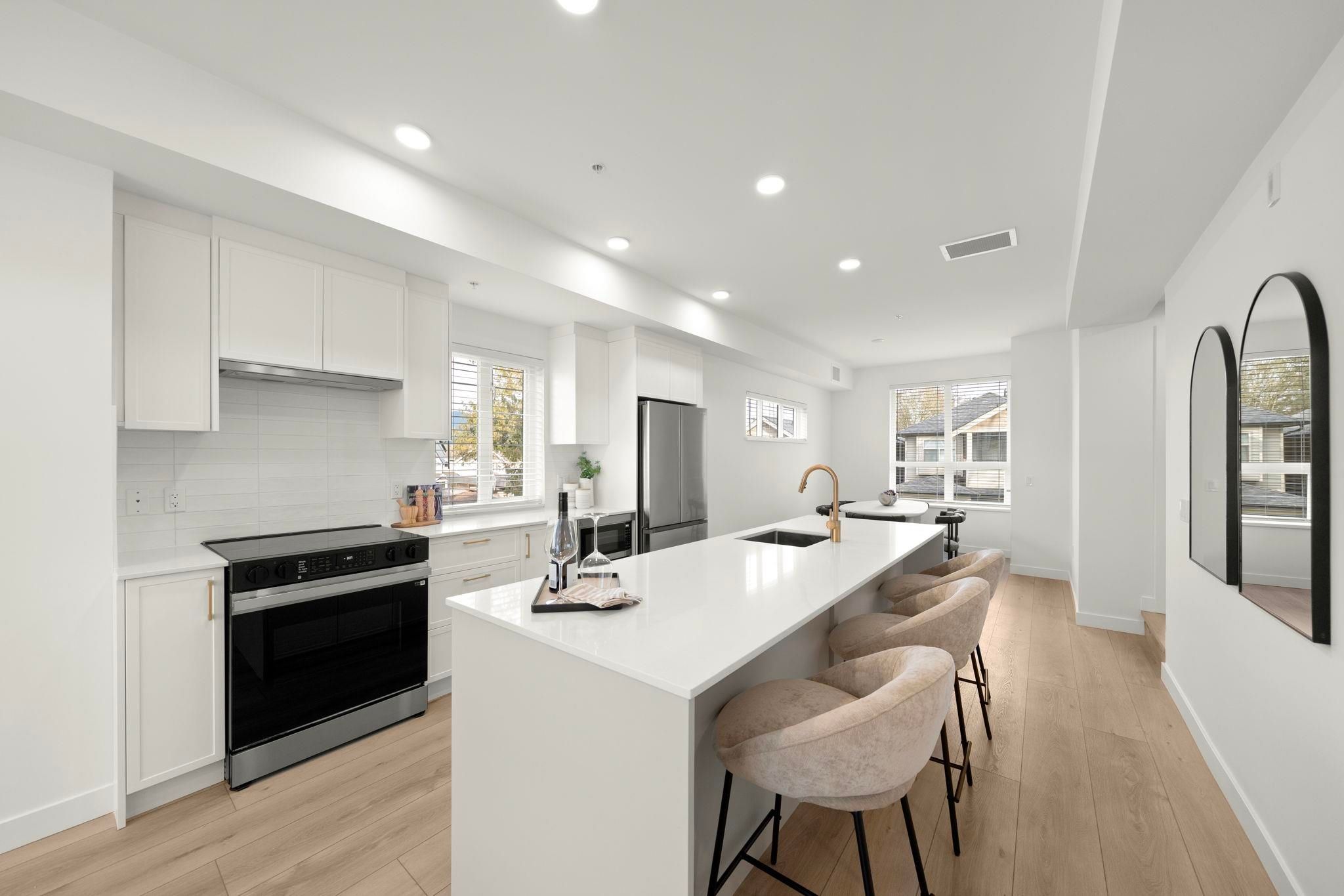 Kitchen at 6-728 Lea Avenue showing the range and cabinetry along the back wall