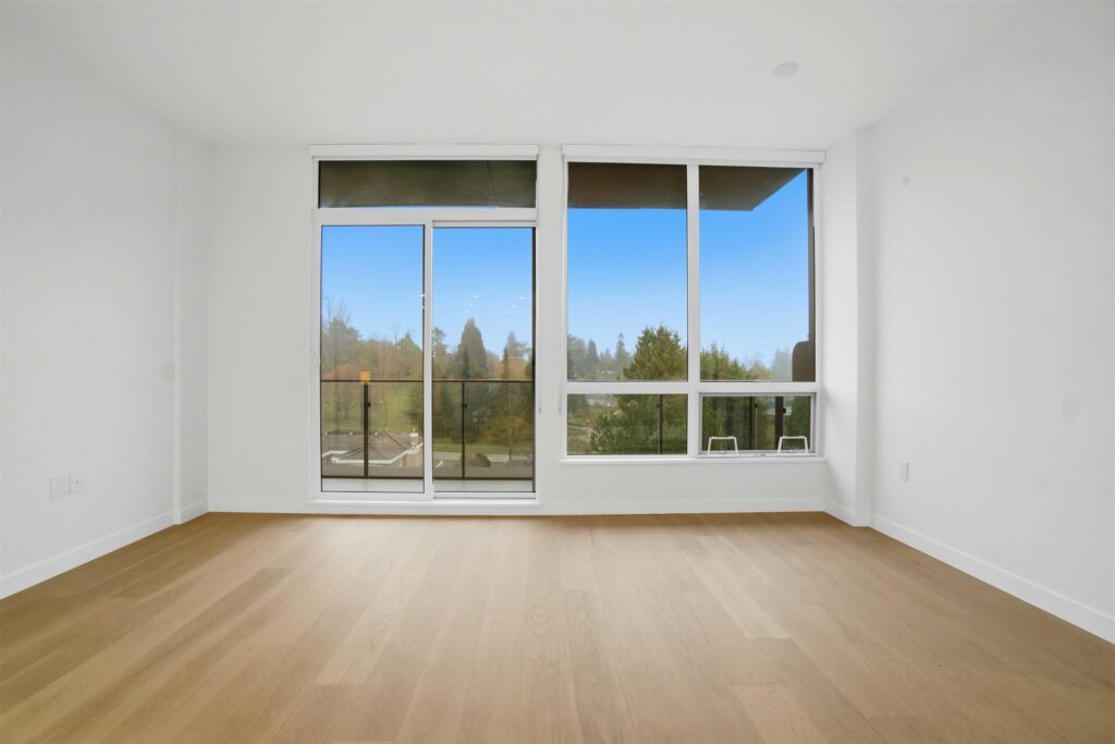 Living room in the 608-5212 Cambie sub-penthouse with natural oak hardwood flooring