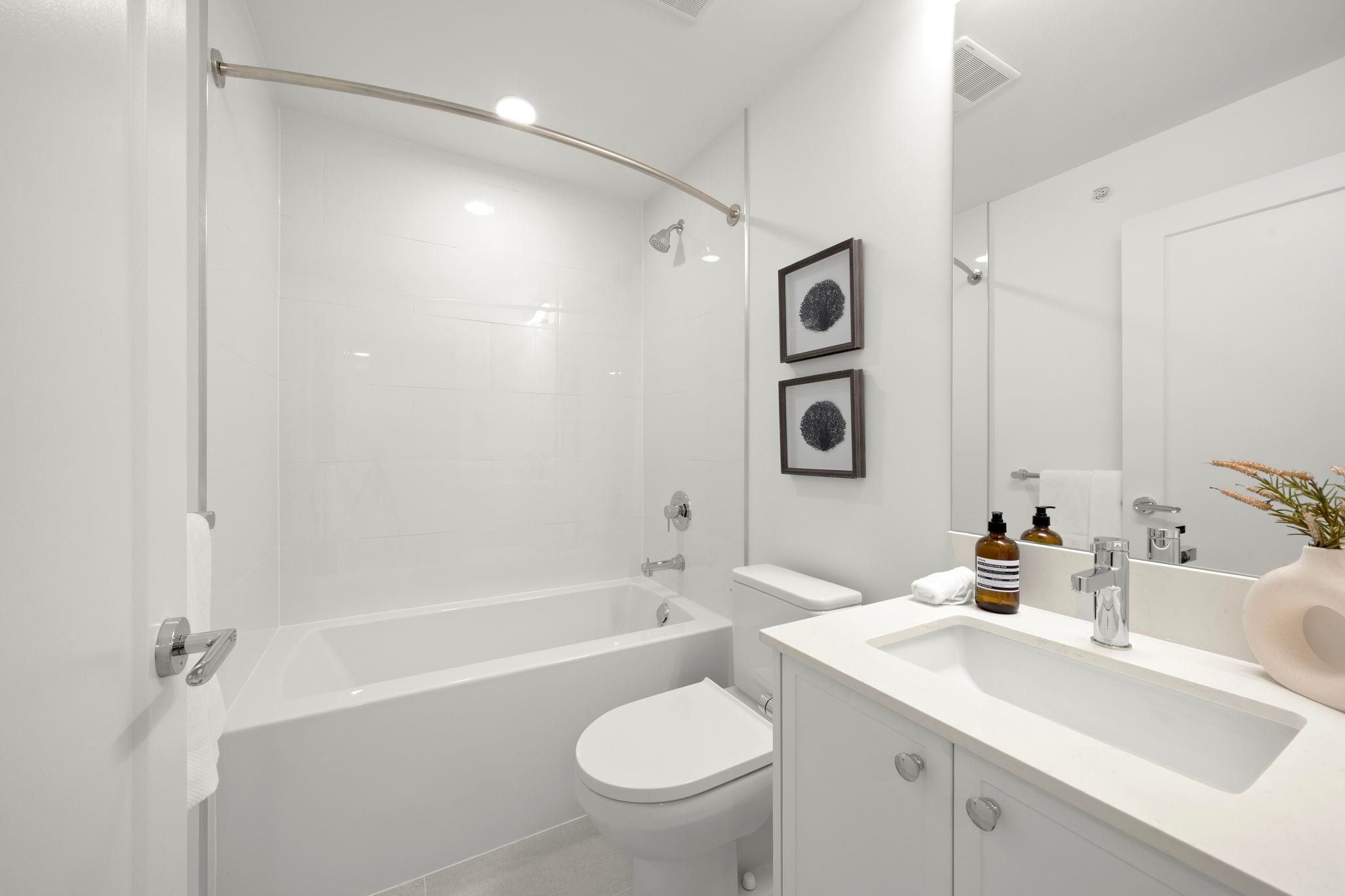 Upstairs 4-piece main bathroom at 6-728 Lea Avenue shared by the secondary bedrooms, with walk-in shower and vanity