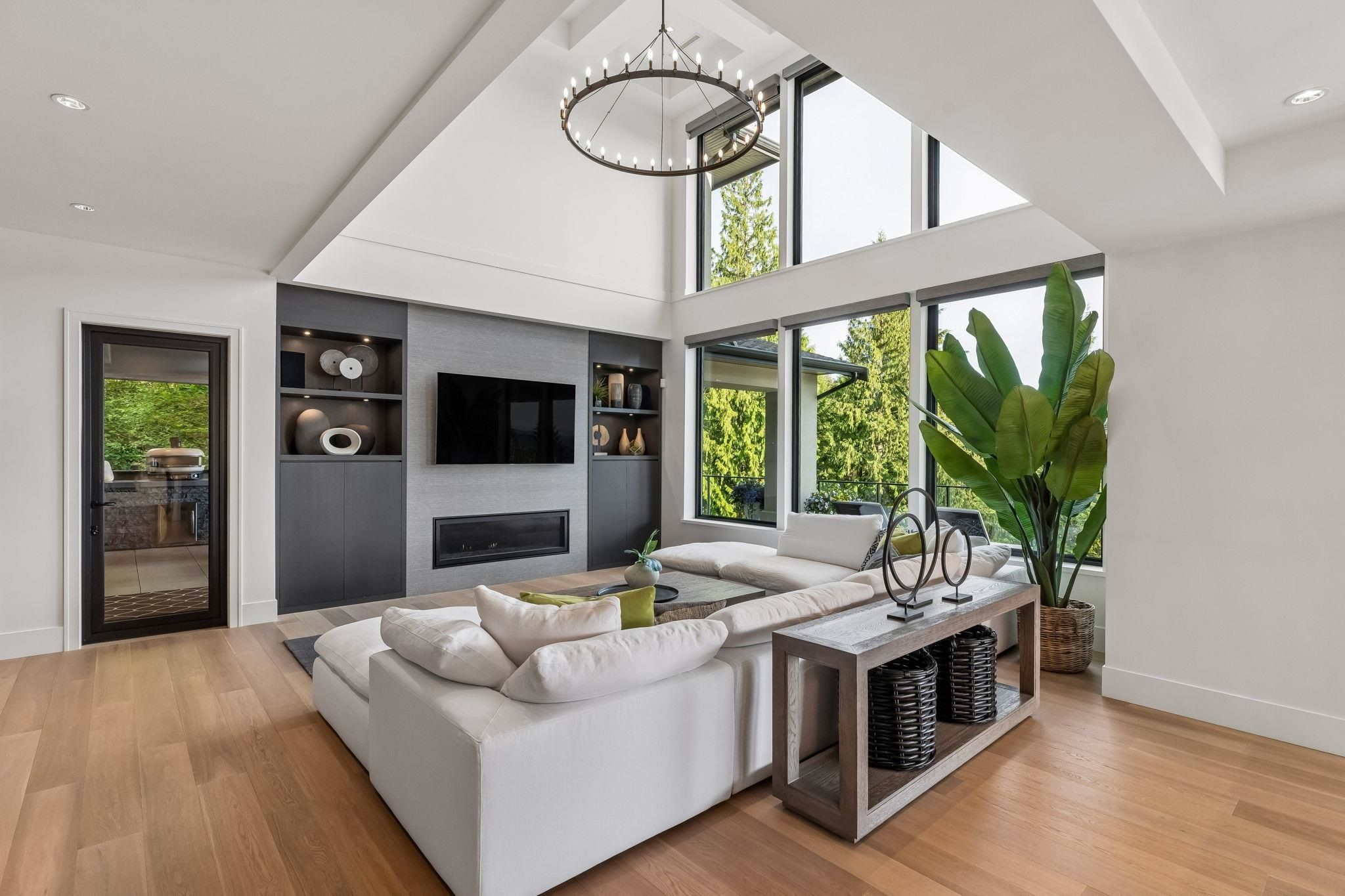 Great room with vaulted ceiling and floor-to-ceiling windows at Anmore estate on Ridge Mountain Drive