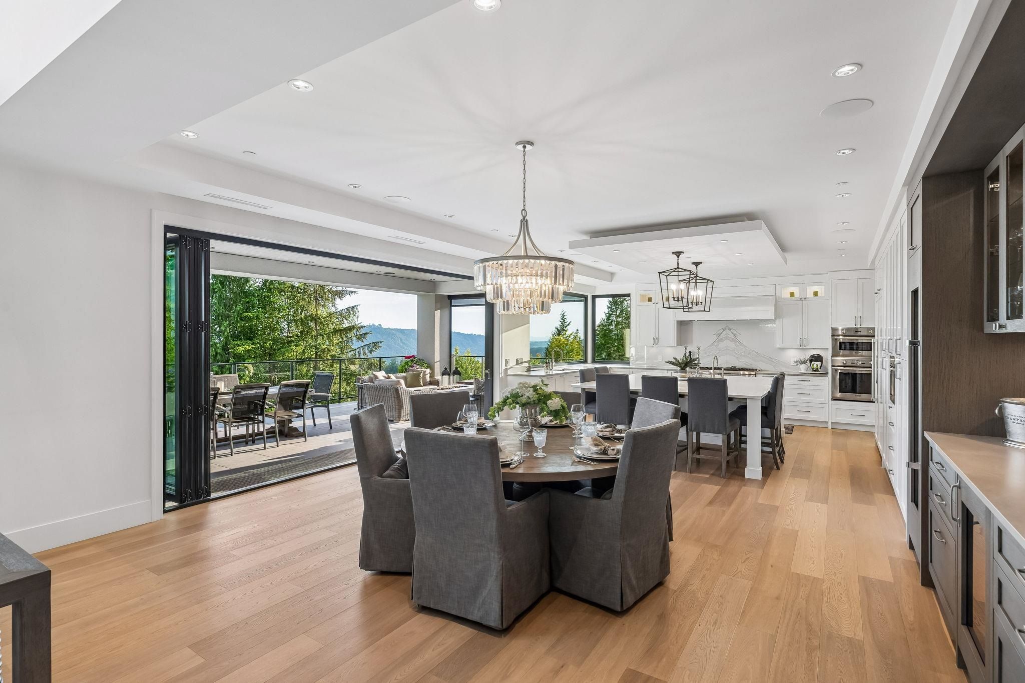 Dining room with view of the forest and mountains at 2051 Ridge Mountain Drive, Anmore