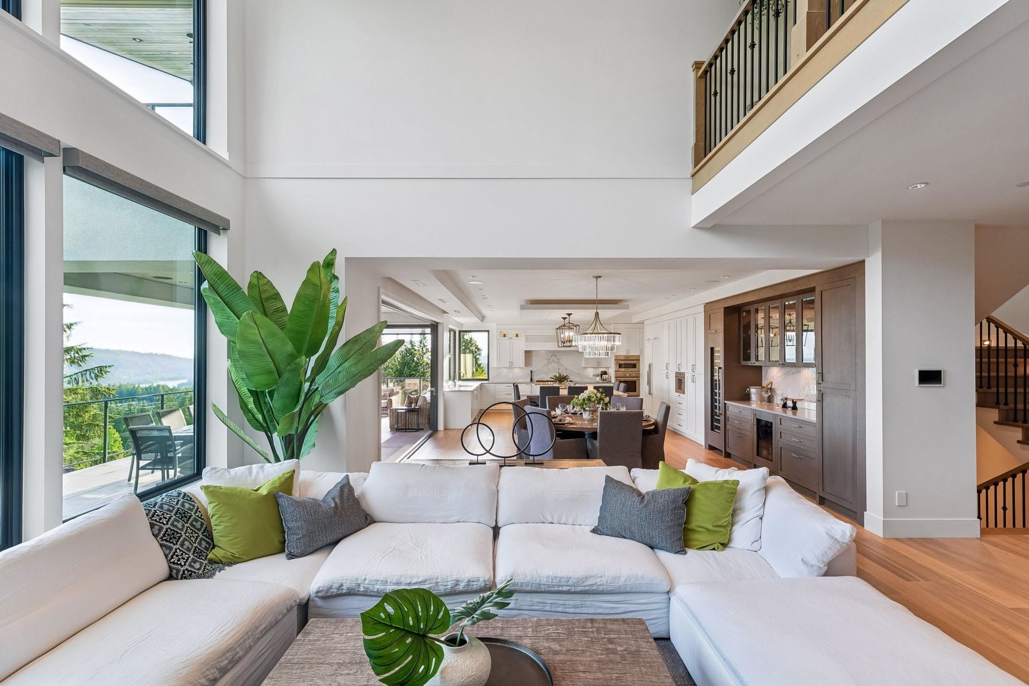 Open-concept living and dining area adjacent to the kitchen at Anmore luxury home