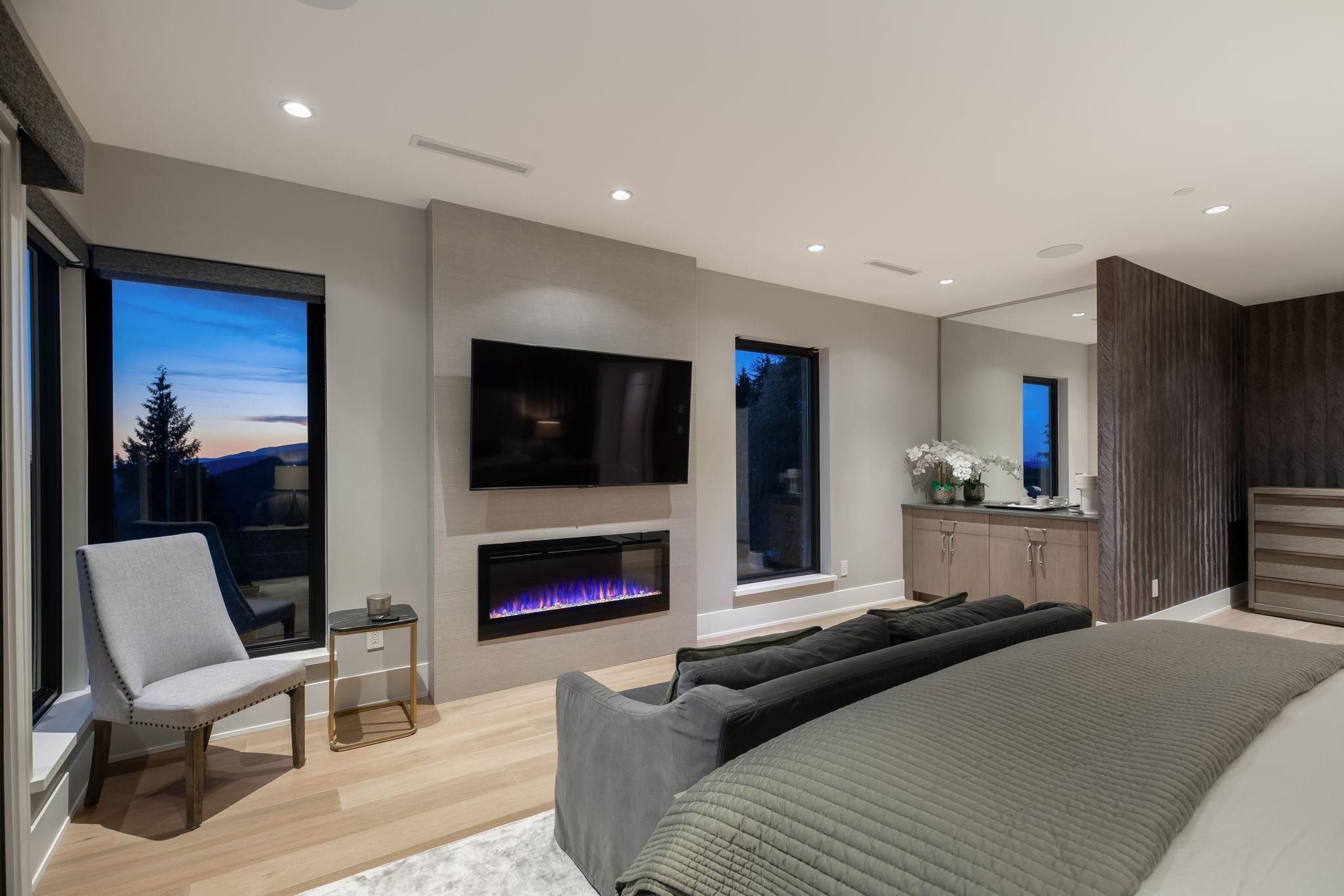 Primary bedroom sitting area with sofa at Anmore luxury estate