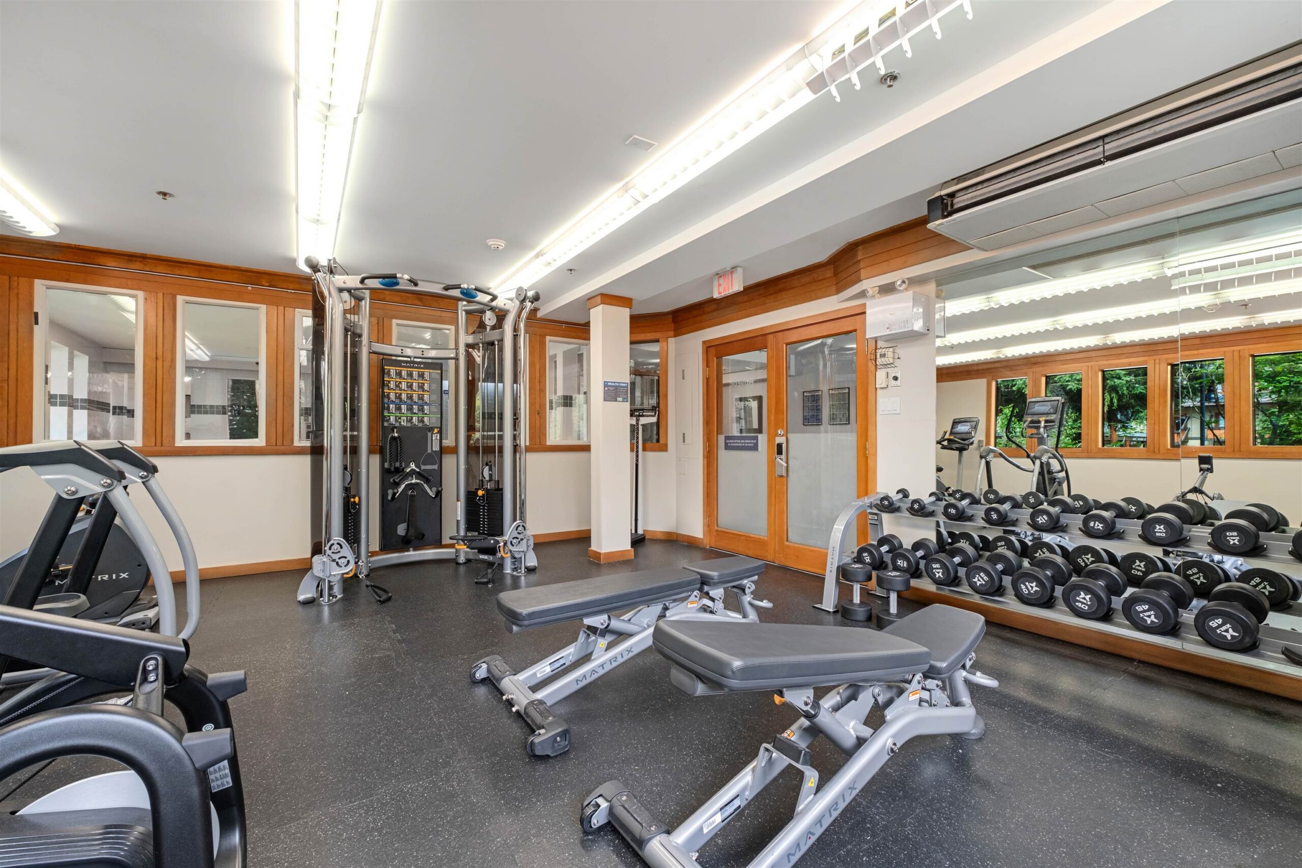 Fitness centre at Whistler Village Inn & Suites — cardio equipment, free weights, and strength machines