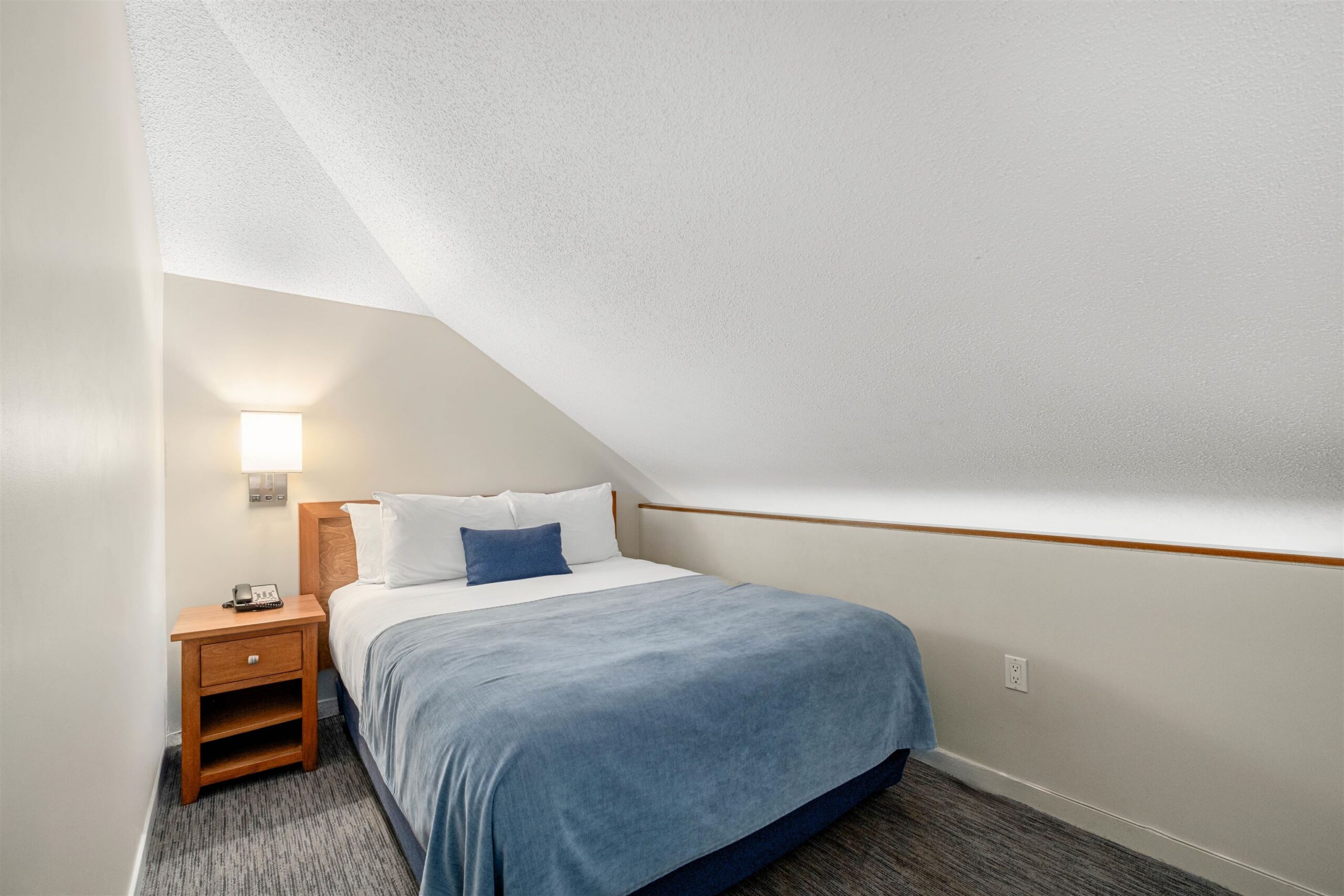 Bedroom at Whistler Village Inn & Suites — one of the two queen beds on Side A