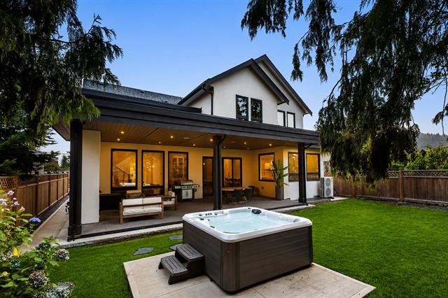 Backyard and covered patio at twilight at 944 Caithness Crescent, Glenayre, Port Moody