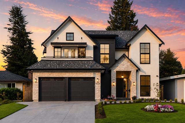 Brand new two-storey custom home exterior at dusk at 944 Caithness Crescent in Glenayre, Port Moody