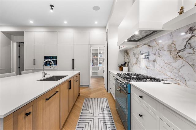 Kitchen island and range detail at Glenayre new-construction home