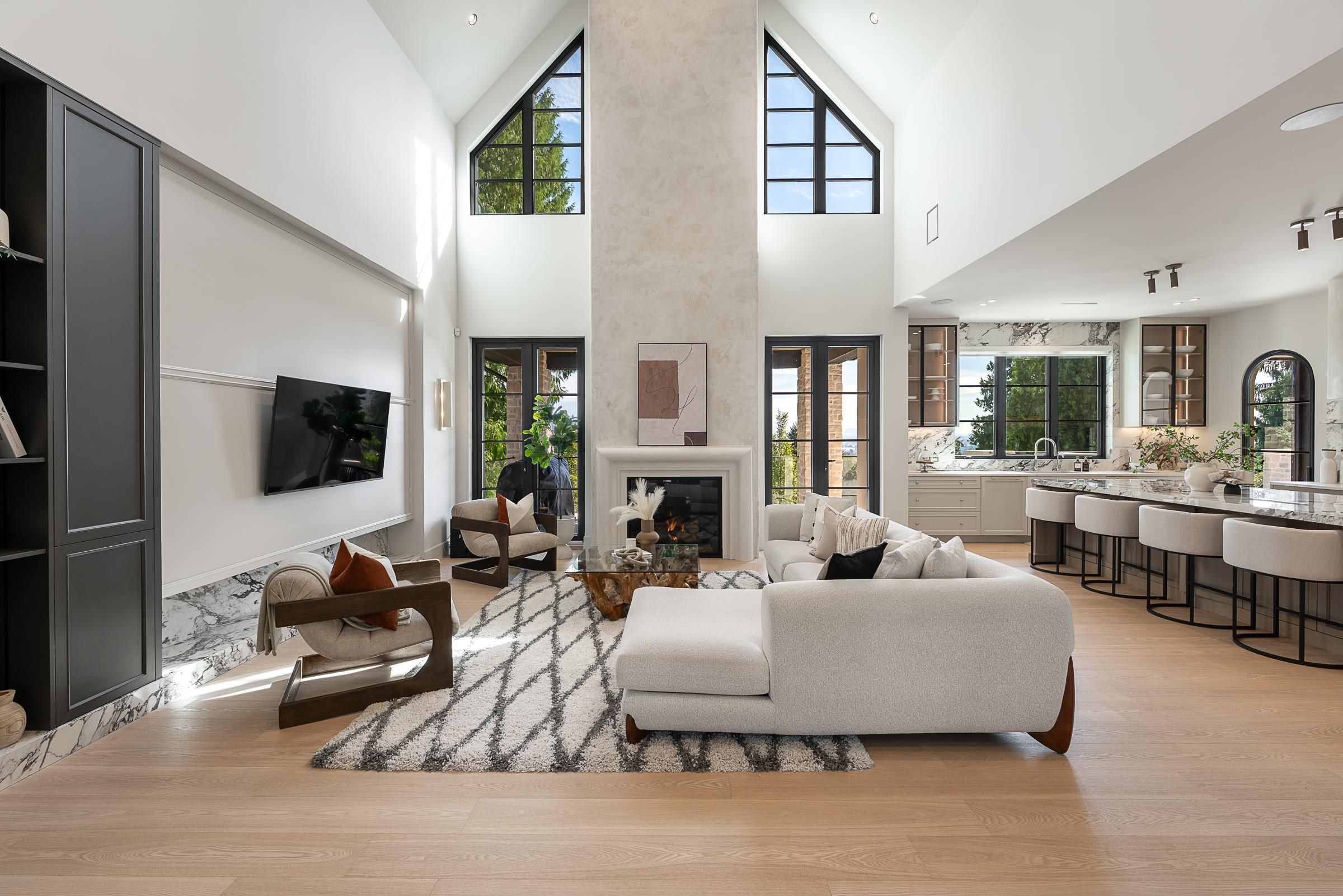 Two-storey great room with vaulted ceiling and stone fireplace at 2976 Lazy A Street, Ranch Park