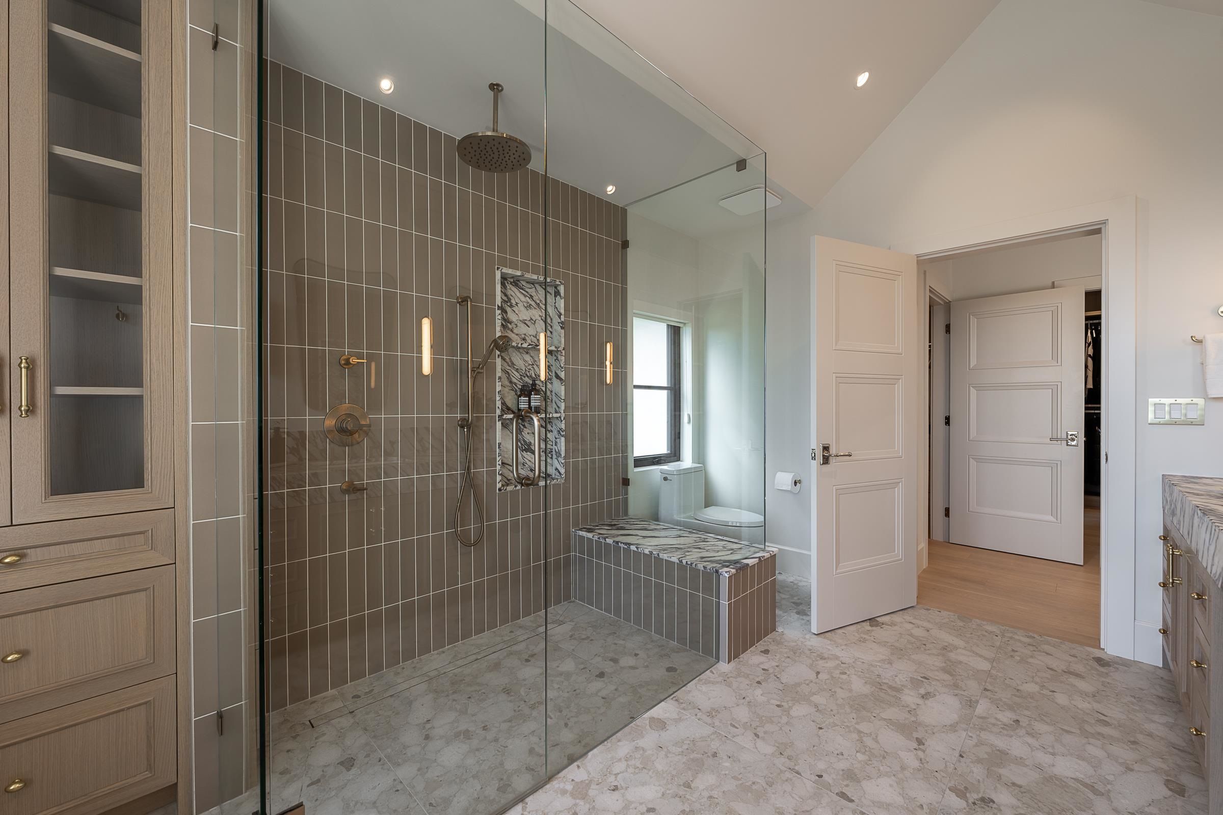 Primary ensuite with dual vanity, freestanding tub and glass shower at 2976 Lazy A Street, Ranch Park