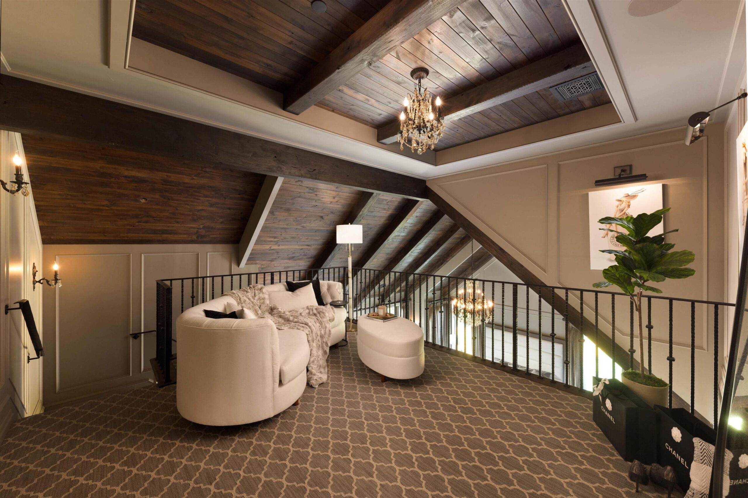 Upper-level lounge overlooking the staircase at Tannin Manor