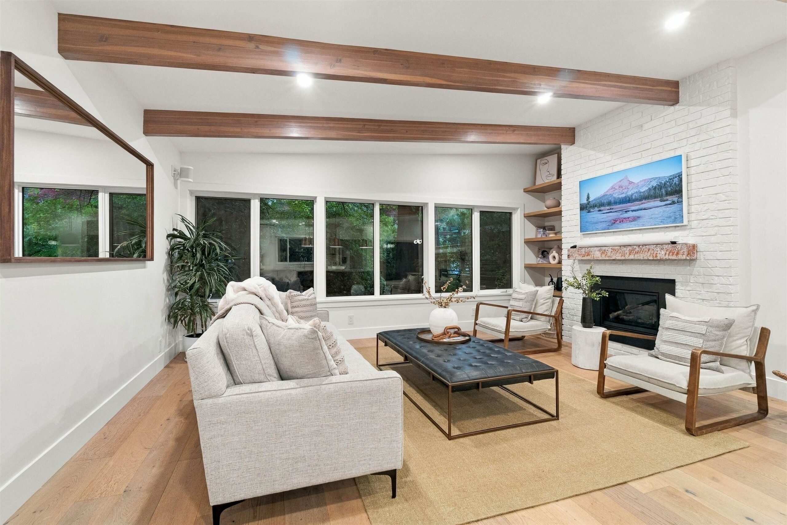 Living room with fireplace in renovated Coquitlam home
